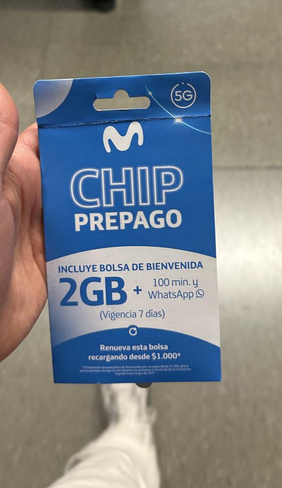 A Movistar prepaid SIM card pack held in a hand